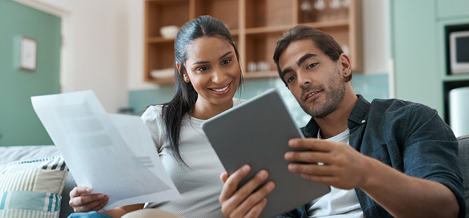 relieved couple paying their energy bill